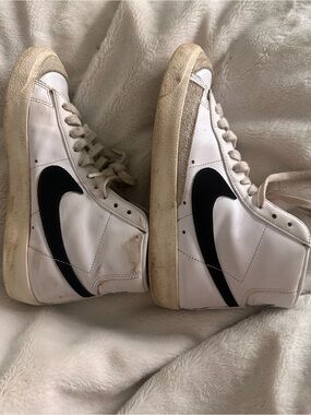 Nike White High-Top Sneakers with Black Swoosh